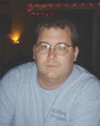 Steven Atwater Husky man with short brown hair and glasses